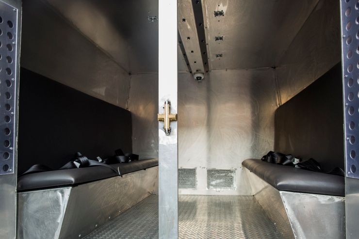 The updated rear holding compartment of a Prisoner Transportation Services van now has a video camera in the ceiling.  